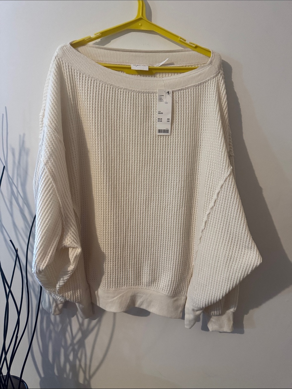 Out from under Urban Outfitters Off-the-Shoulder Waffle-Knit Sweater